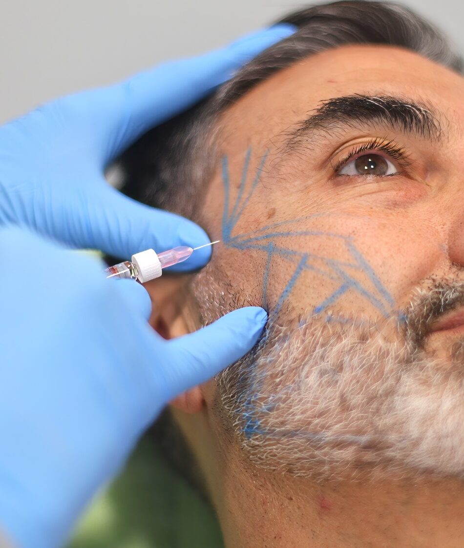 Doctor administering cosmetic injection to patient at beauty clinic.